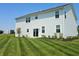 The home has a lovely backyard with large lawn and patio sliding door at 236 Sam Himsel Way, Danville, IN 46122