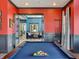Billiards room with an adjacent sitting area, stylish curtains, and modern lighting at 236 Sam Himsel Way, Danville, IN 46122