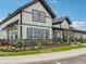 Beautiful two-story home with black trim, white siding, and well manicured landscaping at 236 Sam Himsel Way, Danville, IN 46122