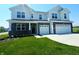 Charming two-story home with a two-car garage and well manicured front lawn at 236 Sam Himsel Way, Danville, IN 46122