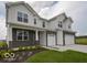 Attractive two-story home with a combination brick and white siding exterior at 236 Sam Himsel Way, Danville, IN 46122