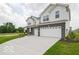 Charming two-story home with a spacious driveway and a manicured lawn at 236 Sam Himsel Way, Danville, IN 46122