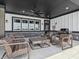 Outdoor lounge area with comfortable seating and a built-in grill under a covered area at 236 Sam Himsel Way, Danville, IN 46122