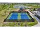 Aerial view of two pickleball courts with a pond, playground and walking trails at 236 Sam Himsel Way, Danville, IN 46122