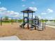 Community playground with a variety of equipment for children and families at 236 Sam Himsel Way, Danville, IN 46122
