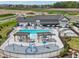 Stunning community pool area featuring pergolas, lounge chairs, splash pad, and playground at 236 Sam Himsel Way, Danville, IN 46122