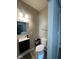 Stylish half-bath with a modern sink, mirror, toilet, and sleek fixtures at 4143 Graceland Ave, Indianapolis, IN 46208