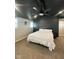 Bedroom with a black ceiling and ceiling fan plus two windows for natural lighting at 4143 Graceland Ave, Indianapolis, IN 46208