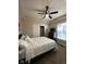Comfortable bedroom with a ceiling fan, a dresser, and a window with a view at 4143 Graceland Ave, Indianapolis, IN 46208