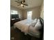Bedroom featuring a ceiling fan, dresser, and windows for ample sunlight at 4143 Graceland Ave, Indianapolis, IN 46208