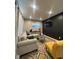Comfortable living room featuring recessed lighting, stylish furnishings, and a mounted television at 4143 Graceland Ave, Indianapolis, IN 46208
