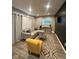Bright living room featuring a plush sectional sofa, modern decor, and an accent wall at 4143 Graceland Ave, Indianapolis, IN 46208