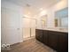 Bathroom with double vanity, large mirror and sliding glass shower at 6036 Card Blvd, Indianapolis, IN 46221