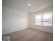 Well-lit bedroom with neutral walls and carpeted floors at 6036 Card Blvd, Indianapolis, IN 46221