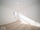 Spacious bedroom with neutral carpeting and large window at 6036 Card Blvd, Indianapolis, IN 46221