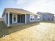 Gray house with covered patio and backyard at 6036 Card Blvd, Indianapolis, IN 46221