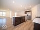 Modern kitchen with island and stainless steel appliances at 6036 Card Blvd, Indianapolis, IN 46221