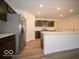 Modern kitchen with stainless steel appliances and island at 6036 Card Blvd, Indianapolis, IN 46221