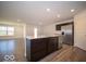 Modern kitchen boasts stainless steel refrigerator and ample counter space at 6036 Card Blvd, Indianapolis, IN 46221