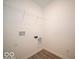 Bright laundry room with wire shelving and hookups at 6036 Card Blvd, Indianapolis, IN 46221