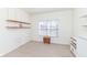 Cozy bedroom with built-in shelving, neutral carpet and window at 12912 Broncos Dr, Fishers, IN 46037