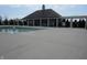 Community pool with covered patio area with furniture and landscaping, great for residents at 12912 Broncos Dr, Fishers, IN 46037