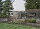 Stone monument sign for The Bristols community with landscaping and wrought iron fence at 12912 Broncos Dr, Fishers, IN 46037