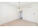 This dining room offers neutral walls, flooring, and a modern light fixture at 12912 Broncos Dr, Fishers, IN 46037
