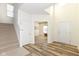 Inviting foyer with wood-look flooring and staircase at 12912 Broncos Dr, Fishers, IN 46037