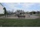 Community playground with multiple slides, climbing structures, benches, and wood chip ground cover at 12912 Broncos Dr, Fishers, IN 46037