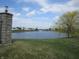 Picturesque community pond with fountain and lush green landscaping, a serene natural retreat at 12912 Broncos Dr, Fishers, IN 46037