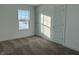 Bedroom with gray carpet, one window, and double closets at 16031 Meadow Frost Ct, Fishers, IN 46037