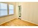 Bright bedroom features wood floors, neutral walls, and natural light from a window at 335 N Grant Ave, Indianapolis, IN 46201