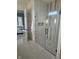 Modern bathroom features a glass shower enclosure with white subway tile and black hardware at 947 W 146Th St, Carmel, IN 46074