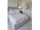 Inviting bedroom features a queen-sized bed with soft linens, next to a window and decorative art at 947 W 146Th St, Carmel, IN 46074