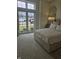 Tranquil bedroom with large windows and a plush bed adorned with neutral bedding at 947 W 146Th St, Carmel, IN 46074
