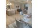 Bright, eat-in kitchen with island, stainless appliances, and breakfast bar, flowing into the living room at 947 W 146Th St, Carmel, IN 46074