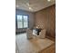 A sophisticated office space boasts a large window, stylish lighting, and decorative wood accent wall at 947 W 146Th St, Carmel, IN 46074