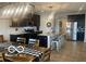 Modern kitchen with stainless steel appliances, a large island with seating, and dark-stained cabinets at 3503 W 100 N, Bargersville, IN 46106