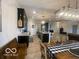 Wide angle view of the modern kitchen featuring dark cabinets, stainless steel appliances and kitchen island at 3503 W 100 N, Bargersville, IN 46106