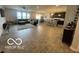 Open-concept living room with modern finishes, dark-stained cabinets, and large windows for natural light at 3503 W 100 N, Bargersville, IN 46106