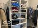 Organized walk-in closet with shelving and hanging space for ample storage in the bedroom at 3503 W 100 N, Bargersville, IN 46106