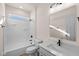 Clean bathroom with white vanity, bathtub and shower at 5034 Bergamot Dr, Brownsburg, IN 46112