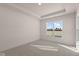 Bright bedroom with large window and plush carpeting at 5034 Bergamot Dr, Brownsburg, IN 46112
