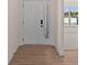 Light and airy entryway with wood-look flooring at 5034 Bergamot Dr, Brownsburg, IN 46112