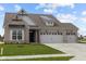 Charming single-story home with a well-manicured lawn, brick facade, and two-car garage at 5034 Bergamot Dr, Brownsburg, IN 46112