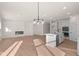 Open concept kitchen with island and fireplace at 5034 Bergamot Dr, Brownsburg, IN 46112