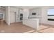 Modern kitchen with white cabinets and a large island at 5034 Bergamot Dr, Brownsburg, IN 46112