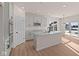 Bright kitchen with white cabinets and sliding glass doors at 5034 Bergamot Dr, Brownsburg, IN 46112
