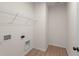 Laundry room with wire shelving and vinyl flooring at 5034 Bergamot Dr, Brownsburg, IN 46112